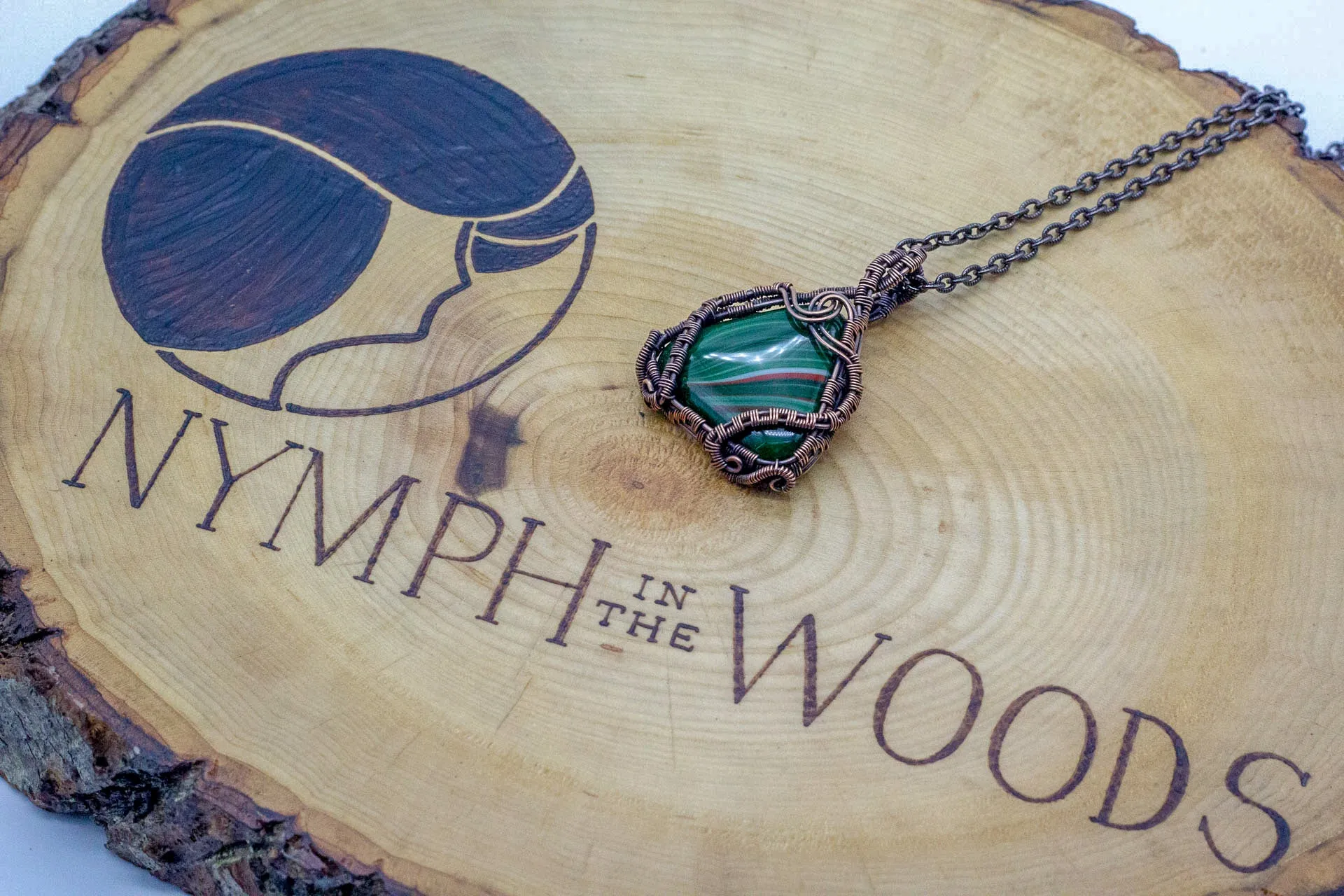 Streaked Green and Red Triangle Pendant with Copper Wire Wrapping